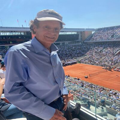 Marshall J. Hubsher witnessing Novak Djokovic's mastery on the clay courts of Roland Garros during the French Open