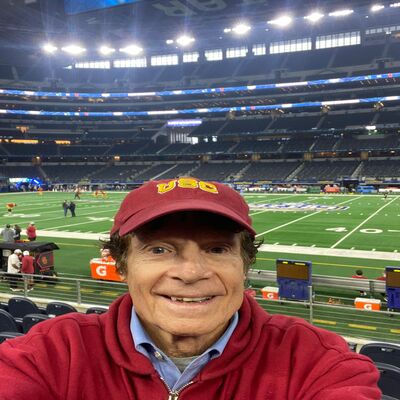 Marshall J. Hubsher at the Cotton Bowl, passionately supporting the USC football team amidst a sea of fans